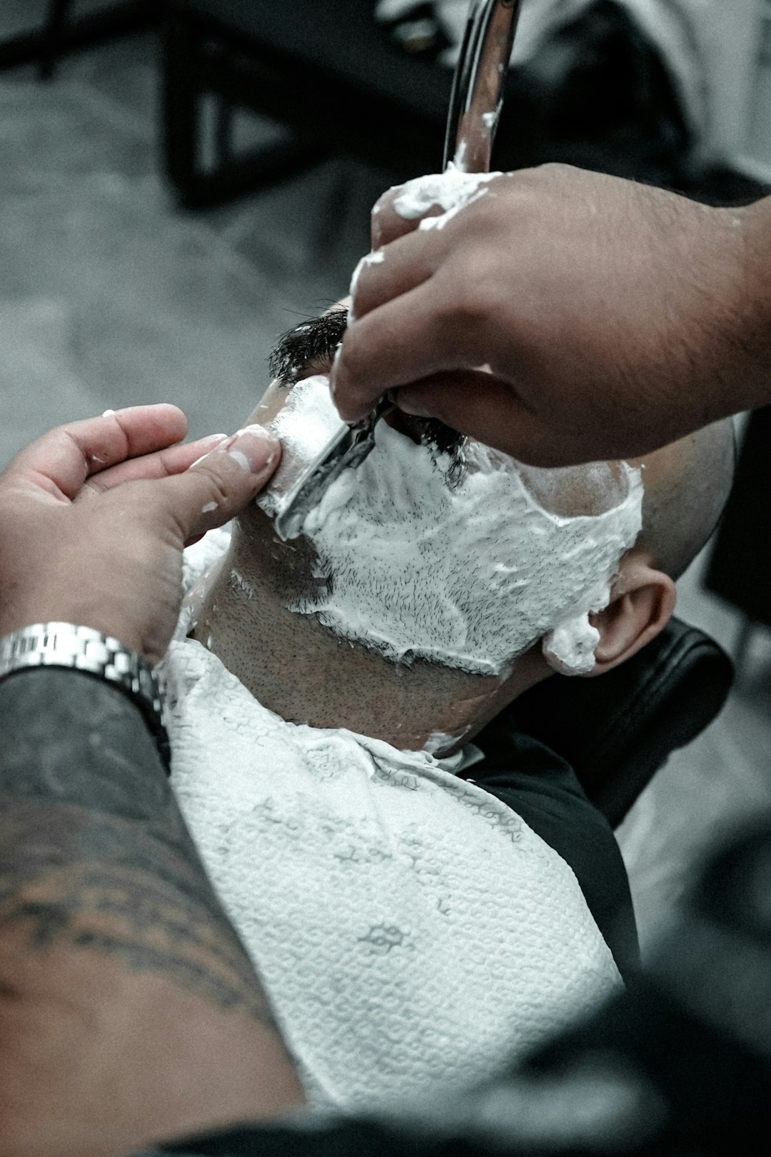 Barber cutting a client's hair